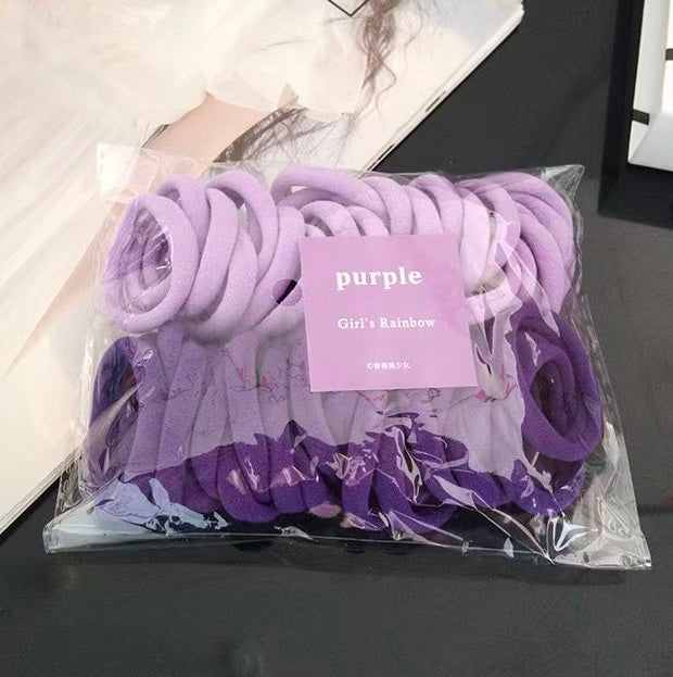 AC78M Paquete ligas moradas para cabello elasticas incluye 50piezas