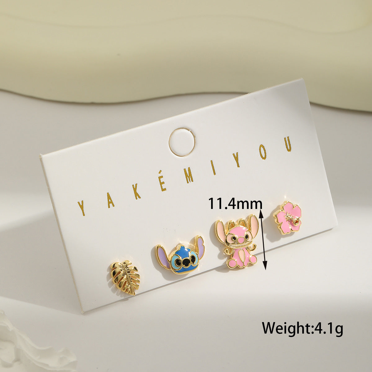 E3615 conjunto de aretes stitch cobre chapado en oro de 18k