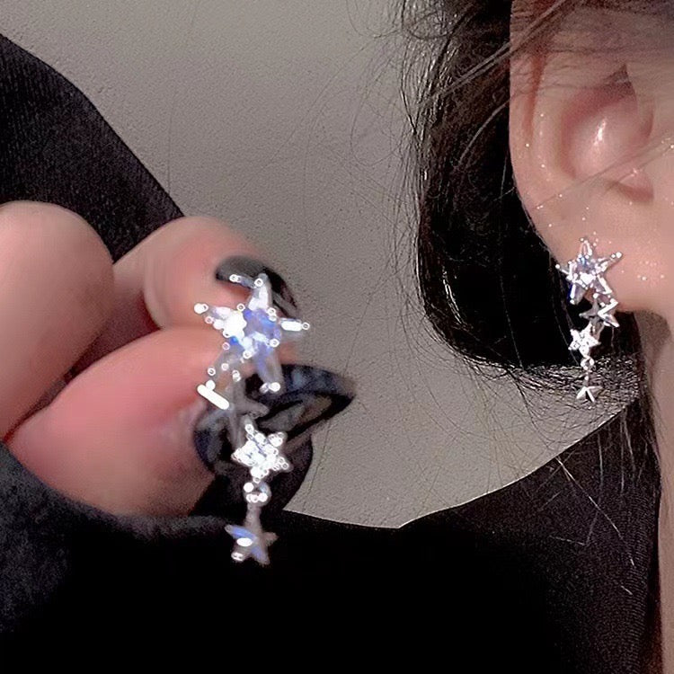 E2571 Aretes estrella brillante plateada aleacion 2.5cm
