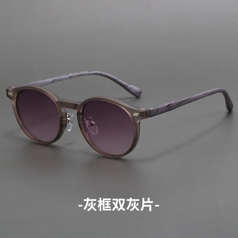 L154L Lentes de sol gris arena marco purpura gris