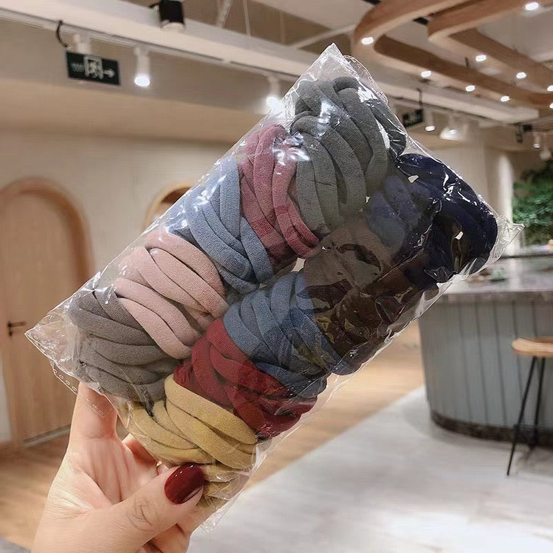 AC78O Paquete ligas colores opacos elasticas incluye 50piezas