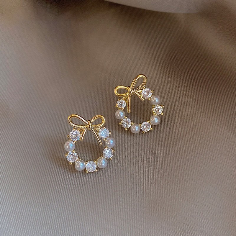 E7111 Aretes arco brillante moño dorado aleacion 1.5cm