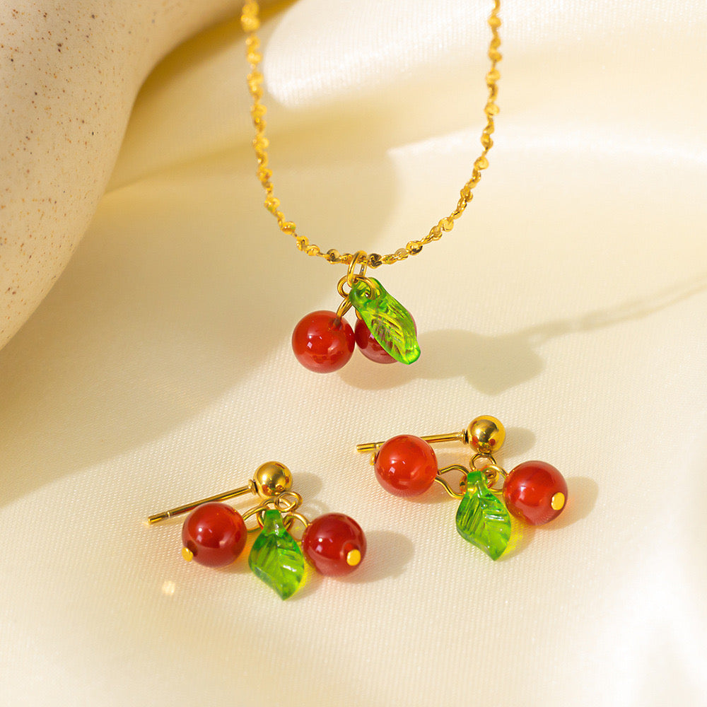 C694 Conjunto cereza collar aretes acero de titanio