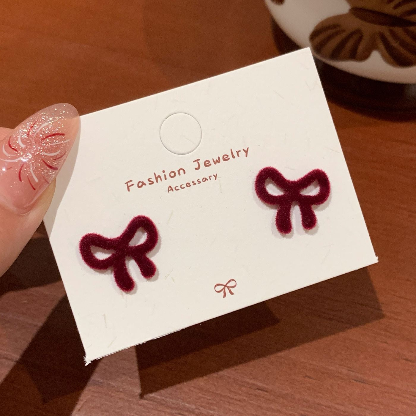 E2323 Aretes moño gamuza 1.5cm