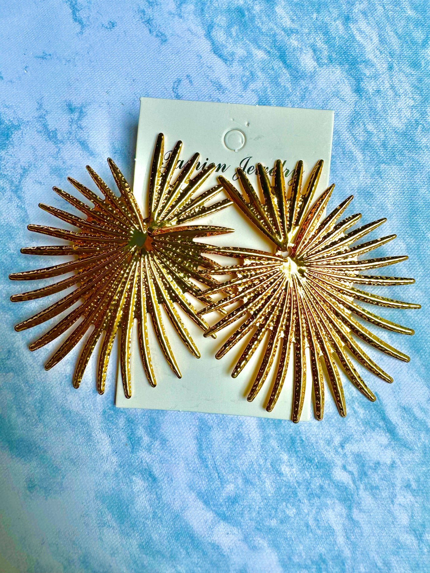 E231 Aretes rayos dorados ligeros aleacion 7cm