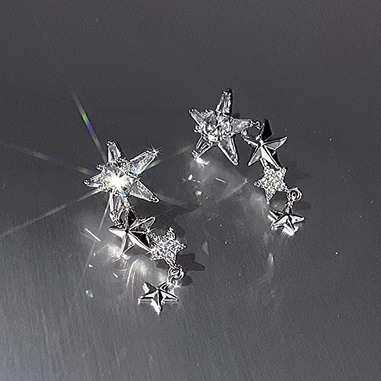 E2571 Aretes estrella brillante plateada aleacion 2.5cm