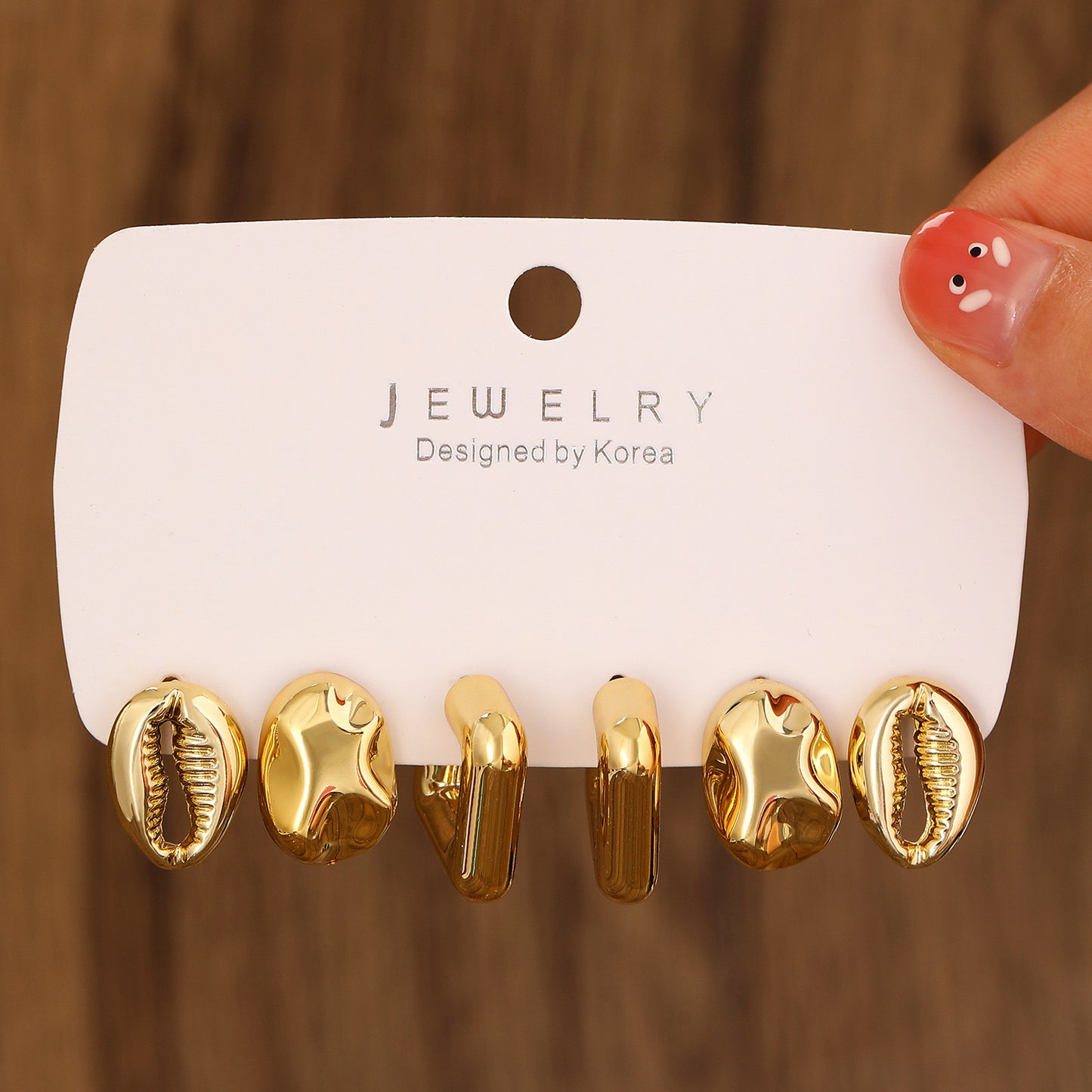 E2725 Conjunto aretes incluye 3 pares recubrimiento de cobre 2cm