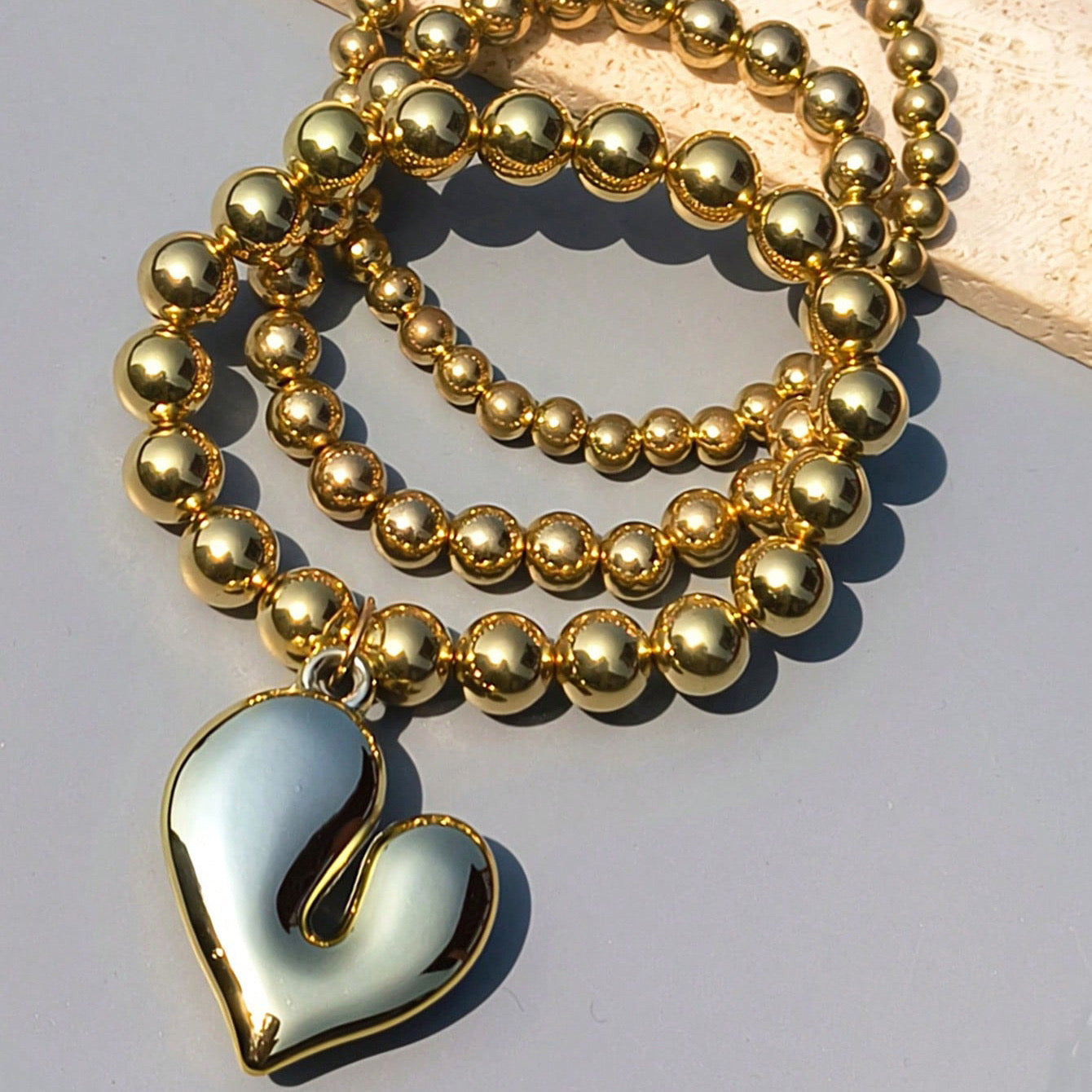 B525 Pulsera corazón dorado cobre elástica