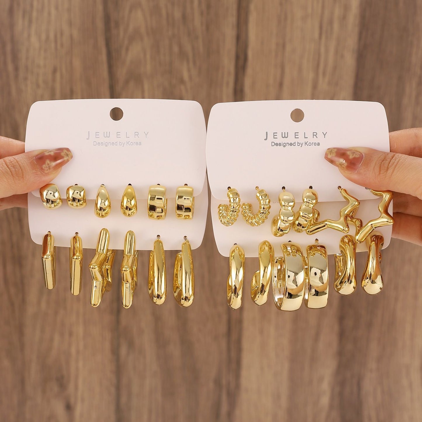 E5847 Connunto de arracadas doradas cobre 4cm incluye 12 pares