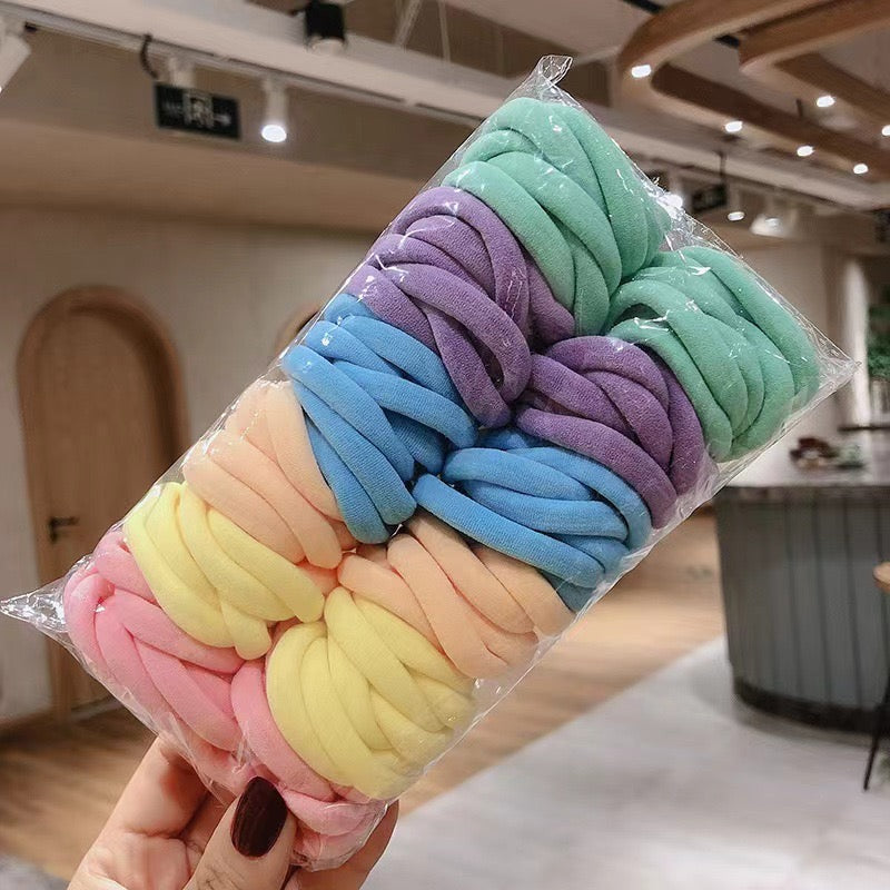 AC78P Paquete ligas color pastel elasticas incluye 50piezas