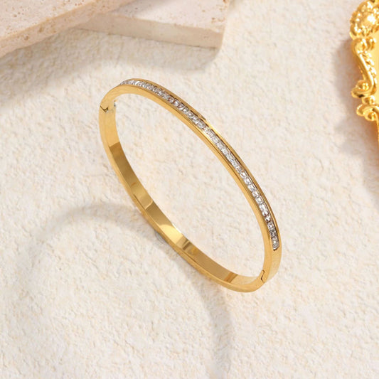 B438 Brzalete oro  de titanio 6.5cm