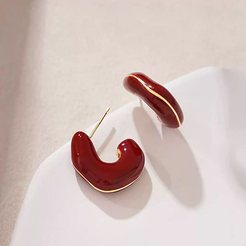 E5877 aretes abstractos color vino línea dorada aleacion 4cm