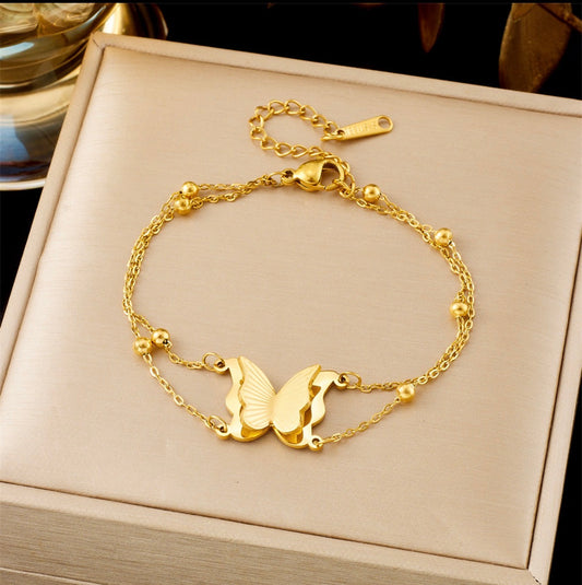 B759 Pulsera mariposa dorada acero titanio 21cm