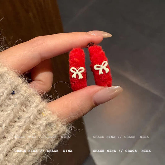 E4966 Arracada roja moño peluche aleacion 4cm