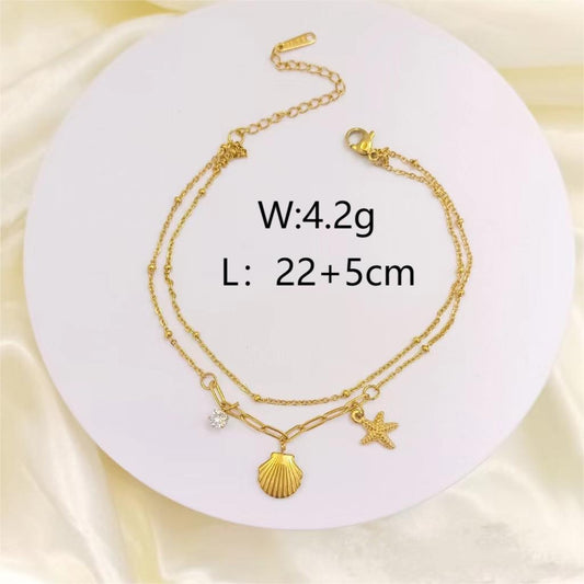 T15 Tobillera acero de titanio chapado en oro 18k largo 25cm dije 1cm