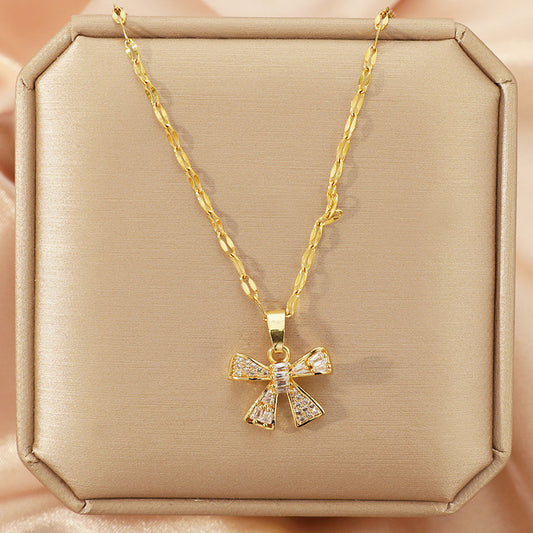 J586 Collar moño dorado brillante acero de titanio largo 22cm dije 2.5cm