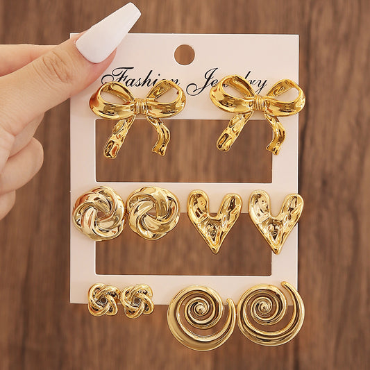 E5933 Conjunto de aretes dorados moños incluye 5 pares aleacion 5cm