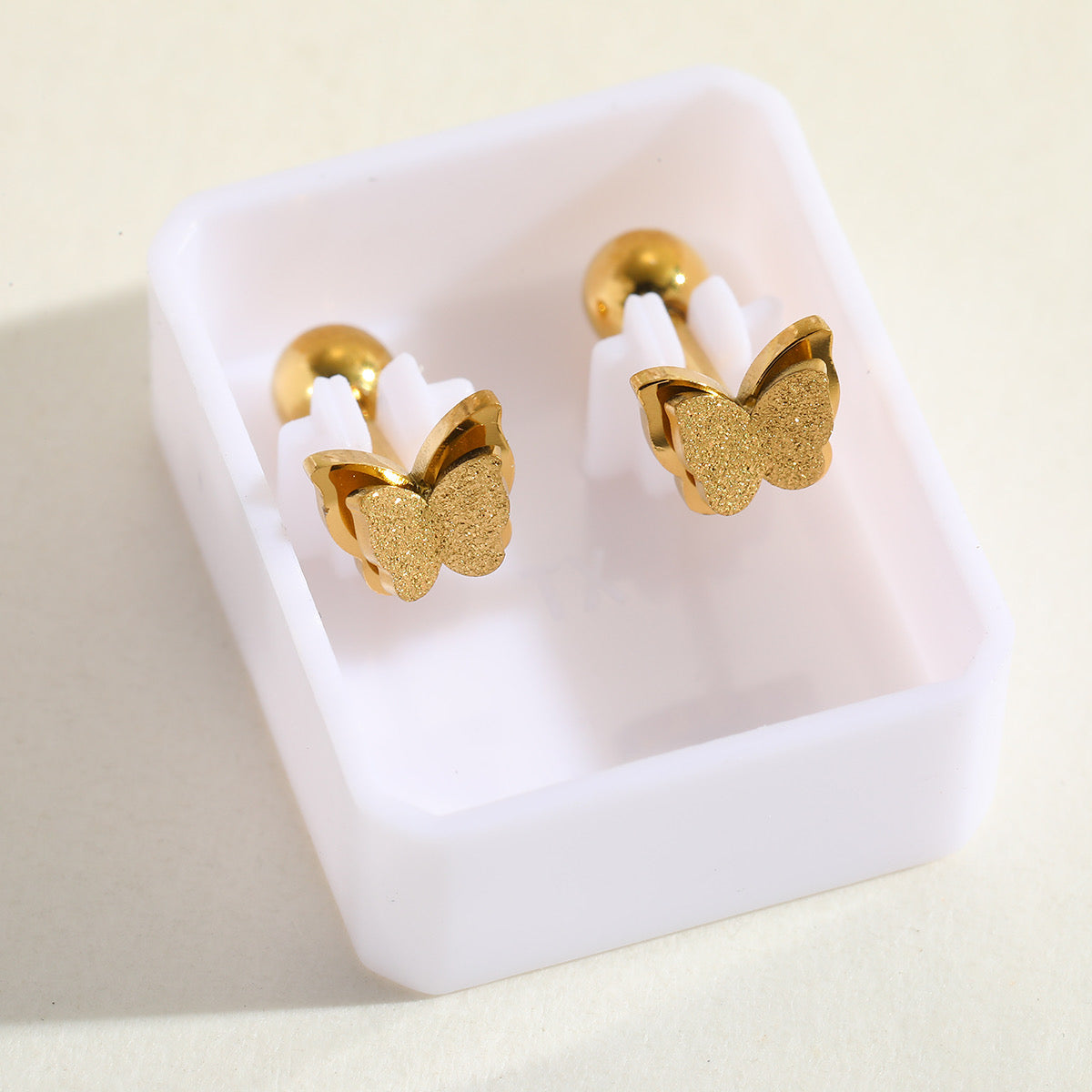 E4640 aretes mariposa acero inoxidable chapado en oro de 18k 1cm