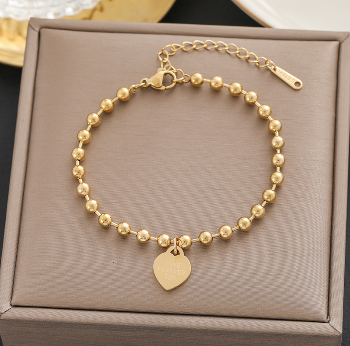 B582 Pulsera corazón dorada acero titanio 20cm
