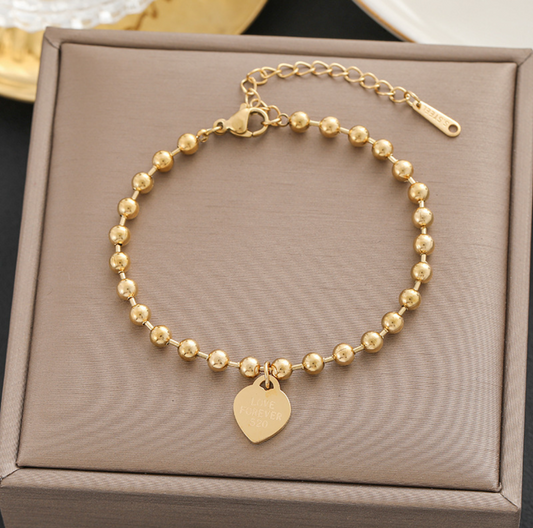 B582 Pulsera corazón dorada acero titanio 20cm