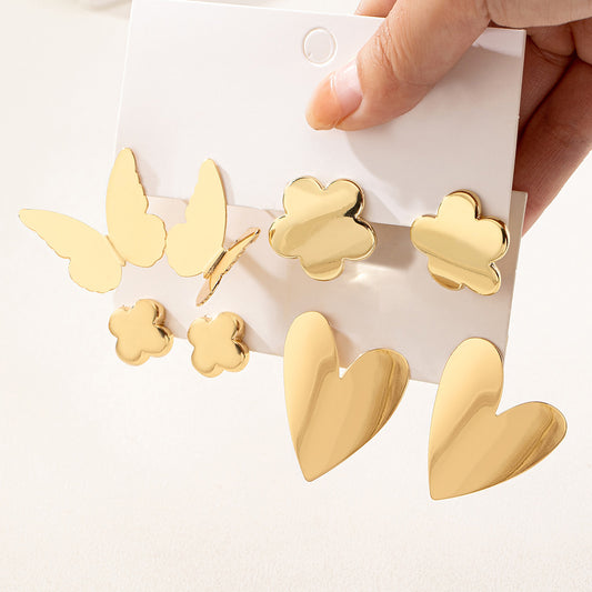 E3723Conjunto de aretes dorados mariposa y corazón cobre 3.5cm