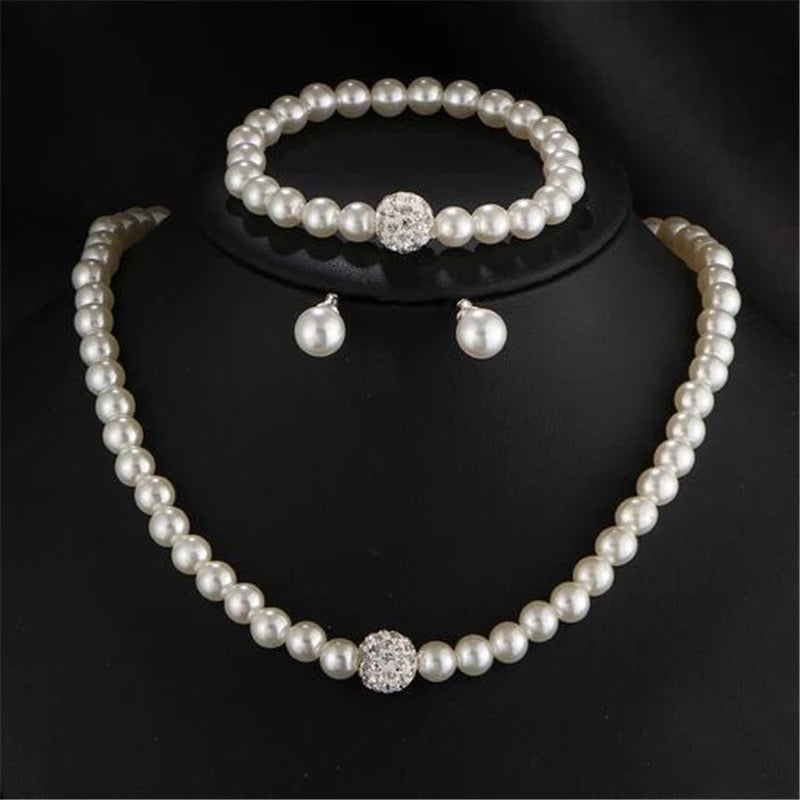 C1604 Juego collar aretes pulsera perlas elastico collar 20cm pulsera elastica aretes .5cm