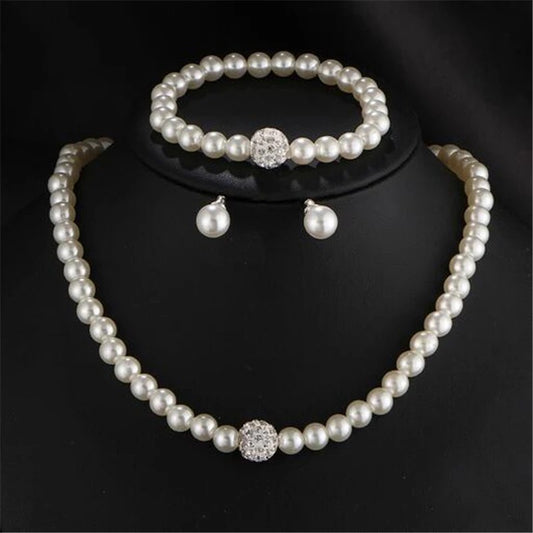 C1604 Juego collar aretes pulsera perlas elastico collar 20cm pulsera elastica aretes .5cm