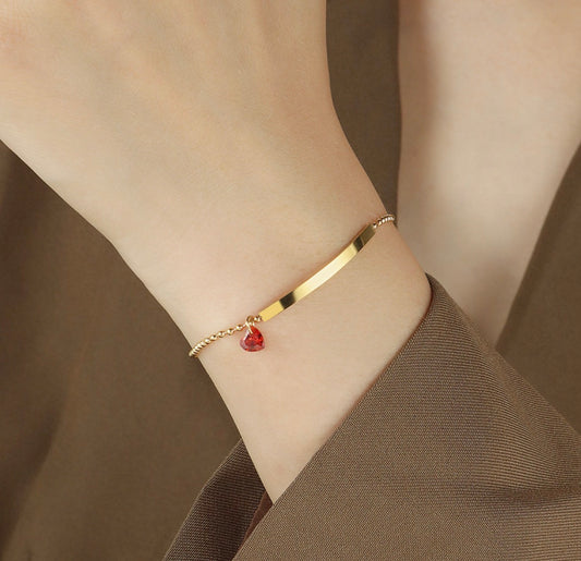 B932 Pulsera dorada corazón rojo acero de titanio 21cm