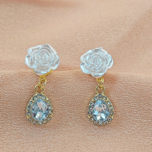E3860 Aretes flor blanca brillante 3cm aleacion