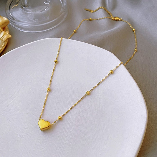 C765 Collar corazón dorado acero de titanio 21cm largo 1cm dije