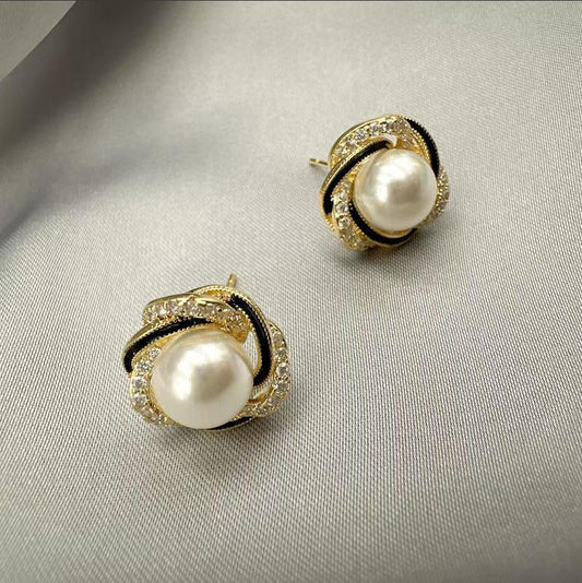 E7103N Aretes perla contorno dorado y negro aleacion 1.5cm