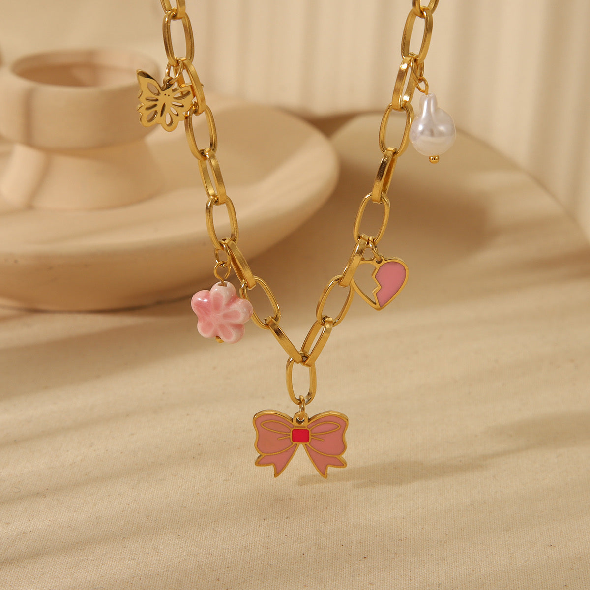 C650 Collar moño rosa acero inoxidable largo 24cm dije 2cm