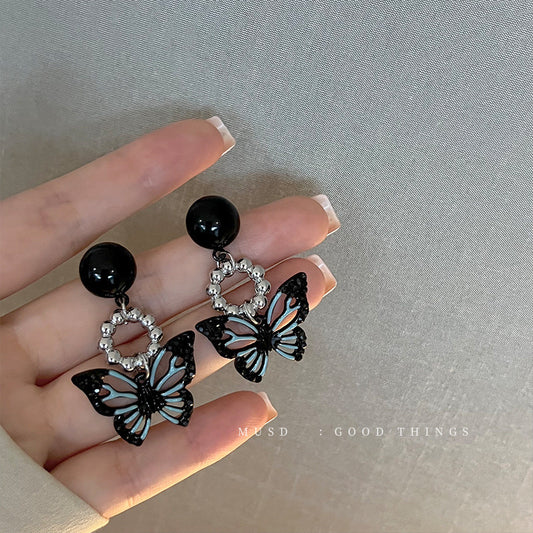 E3612 Aretes mariposa negra aleacion 4cm