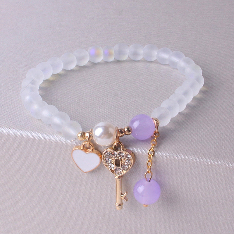 B245 Pulseras llave morada