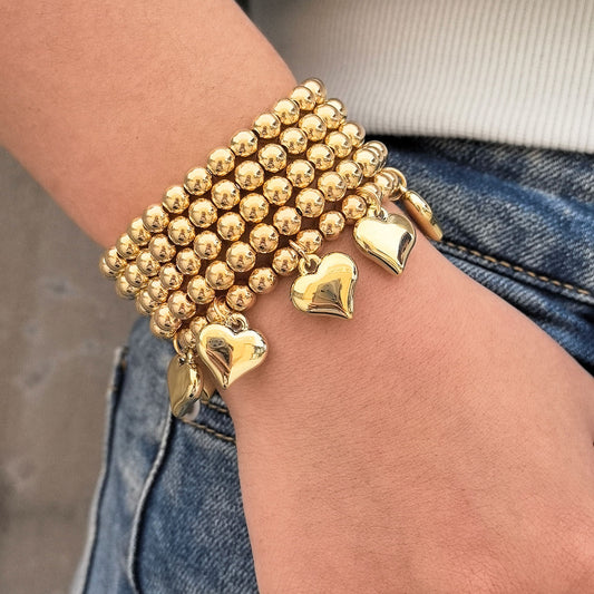 B524 Conjunto de pulseras corazones dorados Cobre elástica