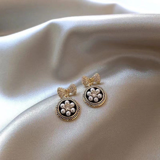 E6085 Aretes moño circulo colgante 1cm aleacion