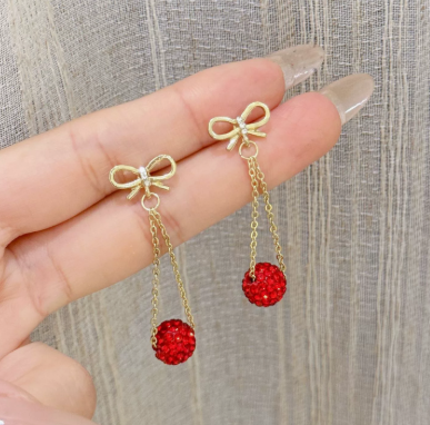 E5862 Aretes moño dorado diamantes rojos colgantes 5cm aleacion