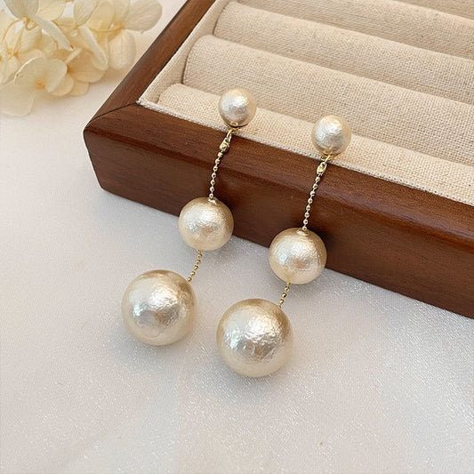 E3872 Aretes colgantes perlas 6.5cm