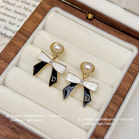 E3869 aretes moño aleacion 2.5cm