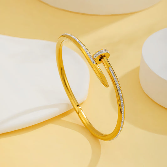 B547 Brazalete clavo dorado acero inoxidable 6cm