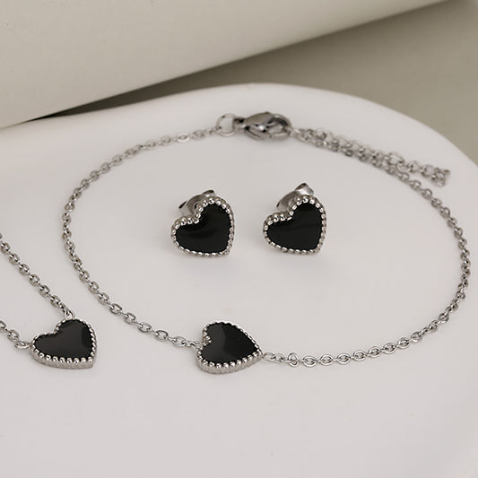 C1157 Conjunto de collar,pulses y aretes plateados corazon negro acero inoxidable