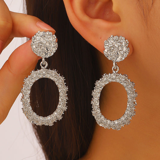 E7126 Aretes ovalado plateado con textura aleacion 8cm