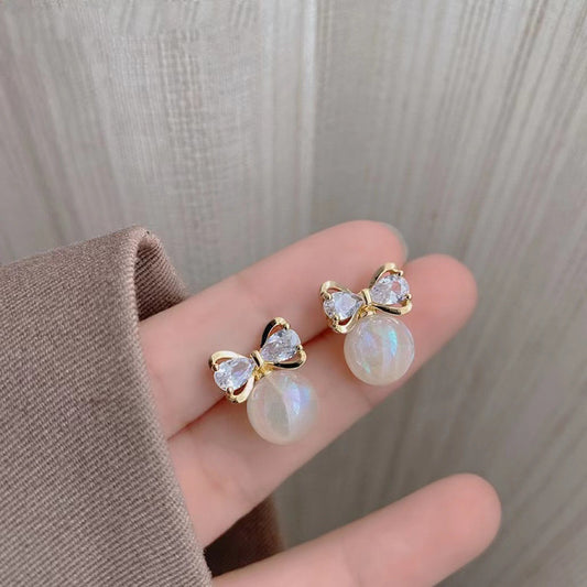 E3892 Aretes perla moño aleacion 1.5cm