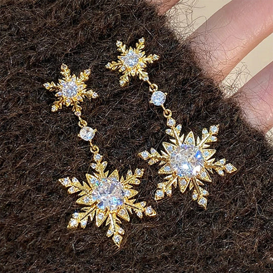 E4398D  Aretes copo de nieve dorado aleacion