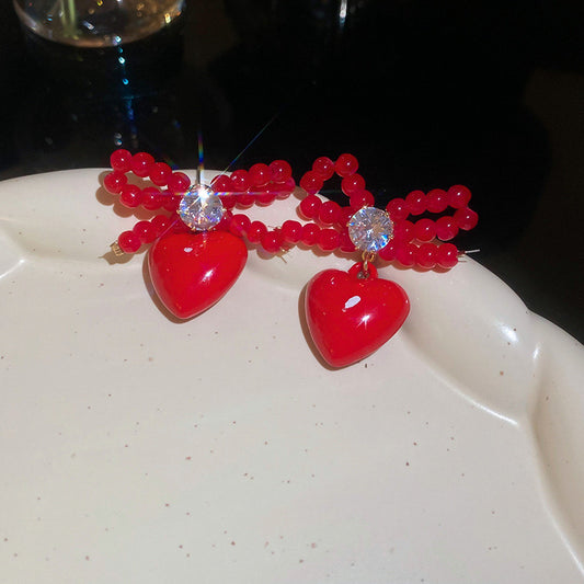 E3255 Aretes moño corazon rojo cobre resina 2cm