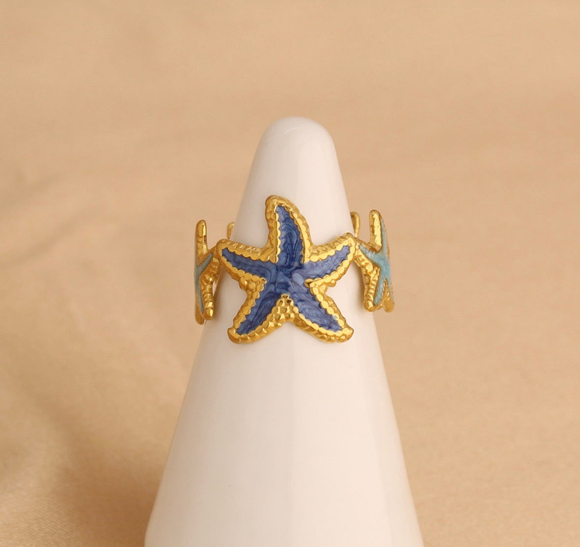 A551 Anillo estrellas de mar tonos azules acero inoxidable abierto