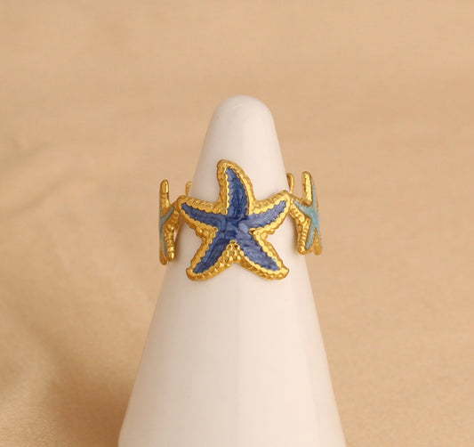 A551 Anillo estrellas de mar tonos azules acero inoxidable abierto