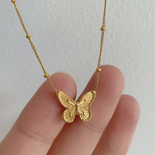 C546 Collar mariposa acero de titanio largo 20cm dije 1.3cm