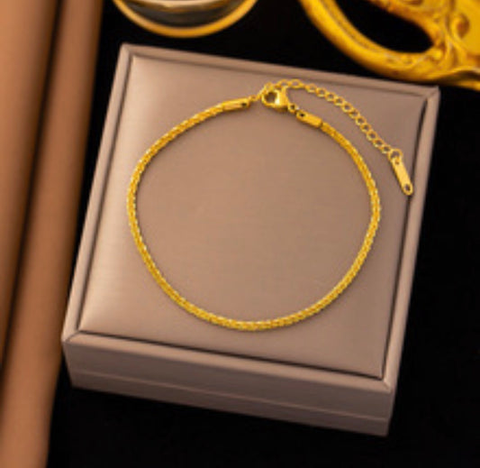 B881 Pulsera torcida dorada acero titanio 19cm