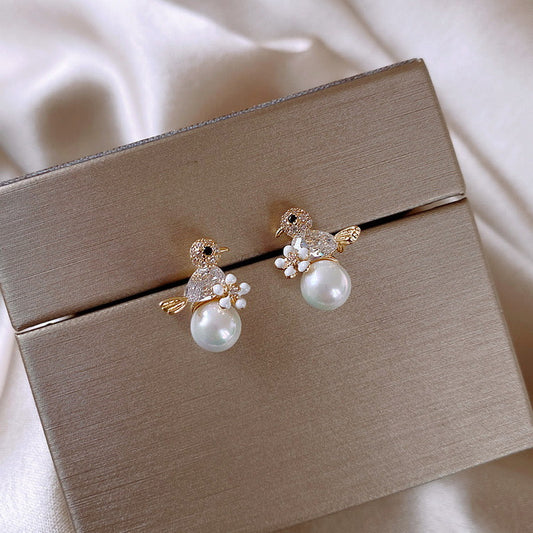 E3403 aretes perla pajarito aleacion en chapado 1.5cm